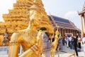 Elegant golden Kinnari statue at Grand Palace