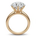 Elegant Golden Ring with Round Diamond Stone for Engagement on White Surface Royalty Free Stock Photo