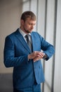 Elegant good looking stylish man waiting for colleagues Royalty Free Stock Photo
