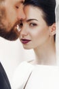 elegant gorgeous bride gently and stylish groom portraits, posing in light. unusual wedding couple in retro style. romantic moment Royalty Free Stock Photo