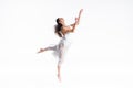 Elegant, graceful ballerina in white dress dancing