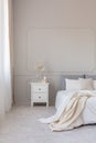 Elegant grey bedroom with copy space on empty wall Royalty Free Stock Photo