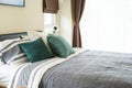 Bedroom interior with king size bed with grey bedding Royalty Free Stock Photo