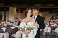 elegant groom hugging young and charming