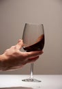 Elegant hand with red wine glass Royalty Free Stock Photo