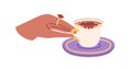 Elegant hand taking hot tea cup from saucer. Noble female fingers holding gold handle of small porcelain teacup with