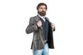 Elegant handsome man in suit. Handsome bearded businessman in classic suits. Sexy male, brutal macho, hipster. Hand in Royalty Free Stock Photo