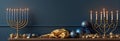 Elegant hanukkah display with menorahs and decor against blue background Royalty Free Stock Photo