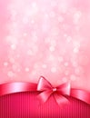 Elegant holiday background with gift pink bow