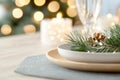 Elegant holiday dining table with festive candlelight and greenery decorations Royalty Free Stock Photo