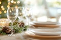 Elegant holiday dining table with festive candlelight and greenery decorations Royalty Free Stock Photo