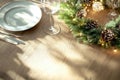 Elegant holiday dining table with festive candlelight and greenery decorations Royalty Free Stock Photo