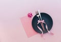 Elegant holiday table place setting with card and cutlery closeup on pink Royalty Free Stock Photo