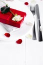 Elegant holiday table setting with red ribbon gift Royalty Free Stock Photo