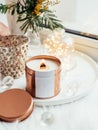 Elegant home decoration with wooden wick burning candle Royalty Free Stock Photo