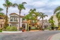 Elegant homes along road lined with palm trees in Long Beach scenic neighborhood Royalty Free Stock Photo