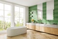 Elegant hotel bathroom interior with vanity and bathtub, panoramic window Royalty Free Stock Photo