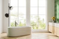Elegant hotel bathroom interior with vanity and tub, panoramic window Royalty Free Stock Photo