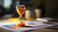 Elegant Hourglass on Business Papers in Soft Office Lighting Royalty Free Stock Photo