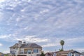 Elegant houses with cloudy sky background at a scenic neighborhood by the sea Royalty Free Stock Photo