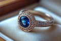 open jewelry box with blue sapphire ring and diamonds Royalty Free Stock Photo