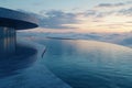 Elegant infinity pool overlooking misty clouds at sunset in a serene architectural setting Royalty Free Stock Photo