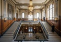 Elegant interior of a grand public building featuring a symmetrical double staircase, flanked by Royalty Free Stock Photo