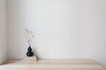 Elegant interior still life, minimal home design concept. Organic shaped black vase with dry grass on table, desk with Royalty Free Stock Photo