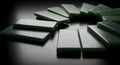 Elegant jade dominoes arranged in a circular pattern on a dark background Royalty Free Stock Photo