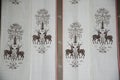 Elegant Japanese noren with deer and tree design on fabric backdrop Royalty Free Stock Photo