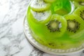 Elegant Kiwi Jelly Cake on Marble, Art of Pastry