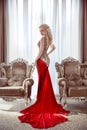 Elegant lady. Beautiful blond woman model in fashion dress with Royalty Free Stock Photo