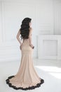 Elegant lady in dress. Beautiful fashion brunette woman in prom