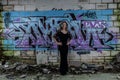Elegant Lady with Graffiti Wall in Derelict Building