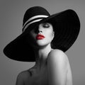 Elegant lady in hat. Black and white fashion portrait.