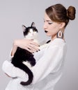 Elegant lady holding cat