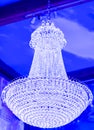 Elegant and large luster.  Luxury theatrical chandelier in modern vintage interior. Branched ornamental light fixture in close-up Royalty Free Stock Photo