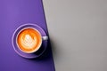 Elegant latte showcasing exquisite foam art on a half purple, half grey background. Generative AI.