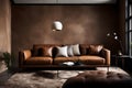 An elegant leather sofa positioned against a textured taupe wall, illuminated by a contemporary pendant light