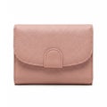 Elegant light pink textured leather mini wallet with secure flap closure Royalty Free Stock Photo