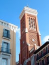 Elegant lines of classical buildings in the touristic part downtown Madrid, Spain. Classy colourful Spanish facades. Tower of