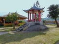 A small chinese pavilion with a beautifully curved roof Royalty Free Stock Photo