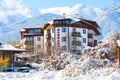 Elegant Lux hotel and snow mountains panorama in bulgarian ski resort Bansko Royalty Free Stock Photo