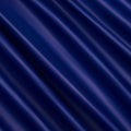 elegant luxury blue background with wavy draped folds of cloth, smooth silk texture with wrinkles and creases in flowing fabric.