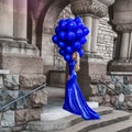 Elegant luxury fashion. Glamour, stylish elegant woman in long gown sequin dress is holding bunch of balloons. Female model in Royalty Free Stock Photo