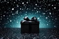 Elegant luxury present gift box with black ribbon bow on isolated black background. Shopping boxing day, Black friday