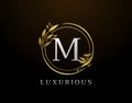 Elegant M Letter Floral Design. Circle Luxury M Gold Logo Icon Royalty Free Stock Photo