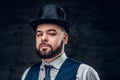 Elegant male in cylinder hat and waistcoat. Royalty Free Stock Photo