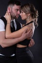 Elegant man embraces his sexy woman who closed her eyes with pleasure Royalty Free Stock Photo