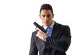 Elegant man with gun, dressed as a spy or secret agent Royalty Free Stock Photo